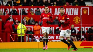 MANCHESTER, ENGLAND - FEBRUARY 04: Raphael Varane and Casemiro of Manchester United in action during the Premier League match between Manchester United and West Ham United at Old Trafford on February 04, 2024 in Manchester, England. (Photo by Ash Donelon/Manchester United via Getty Images)