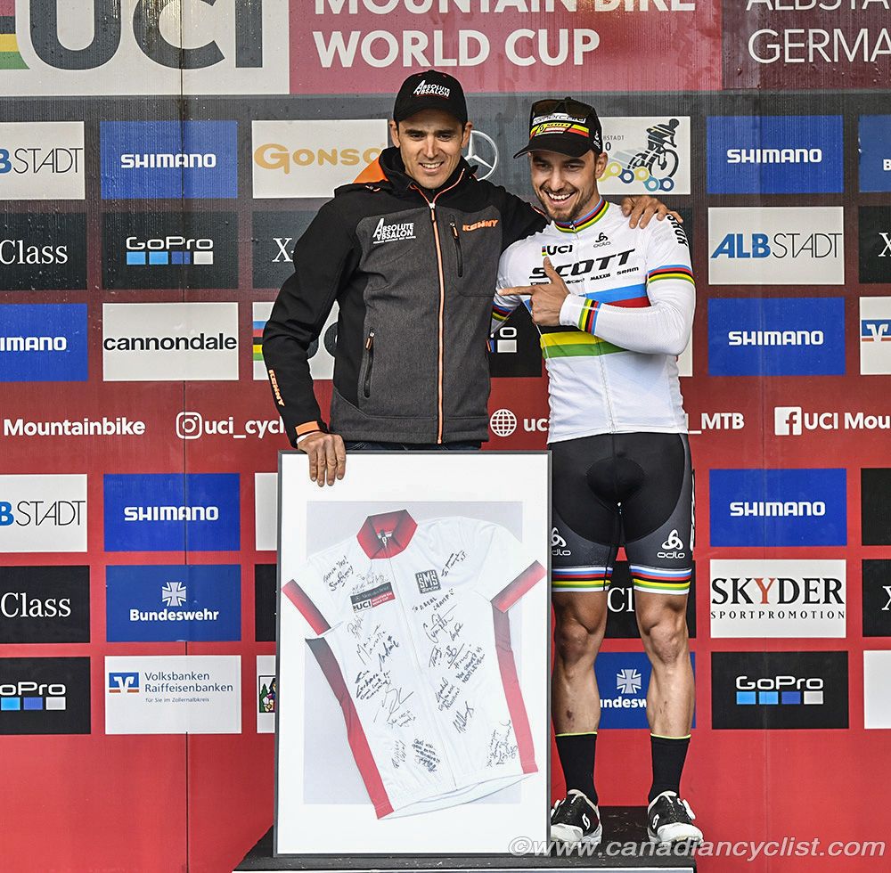 Julien Absalon was presented with gifts by Nino Schurter on behalf of the UCI