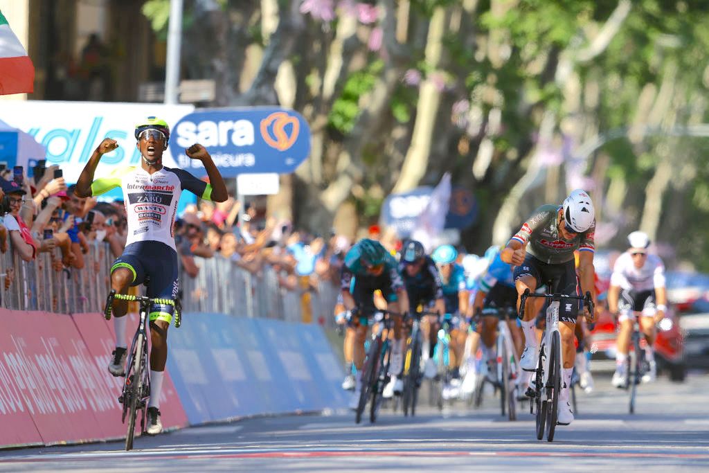 JESI, ITALY - MAY 17: (L-R) Hailu Biniam Girmay of Eritrea and Team Intermarch&Atilde;&copy; - Wanty - Gobert Mat&Atilde;&copy;riaux celebrates at finish line as stage winner ahead of Mathieu Van Der Poel of Netherlands and Team Alpecin - Fenix during the 105th Giro d'Italia 2022, Stage 10 a 196km stage from Pescara to Jesi 95m / #Giro / #WorldTour / on May 17, 2022 in Jesi, Italy. (Photo by Michael Steele/Getty Images)