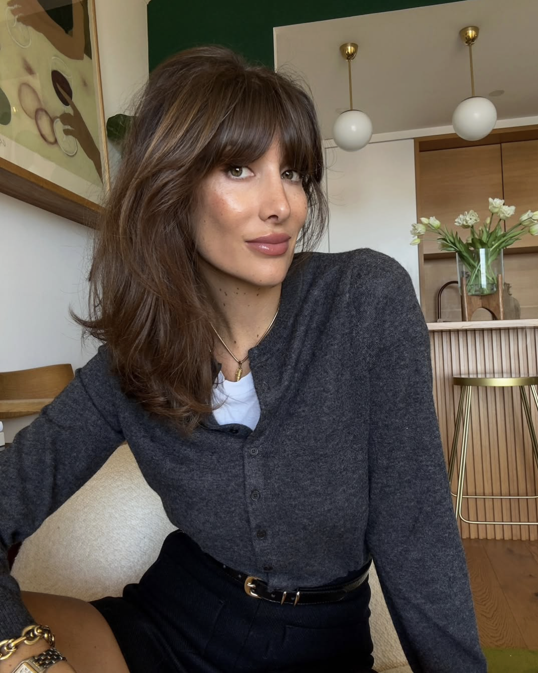 woman in grey cardigan