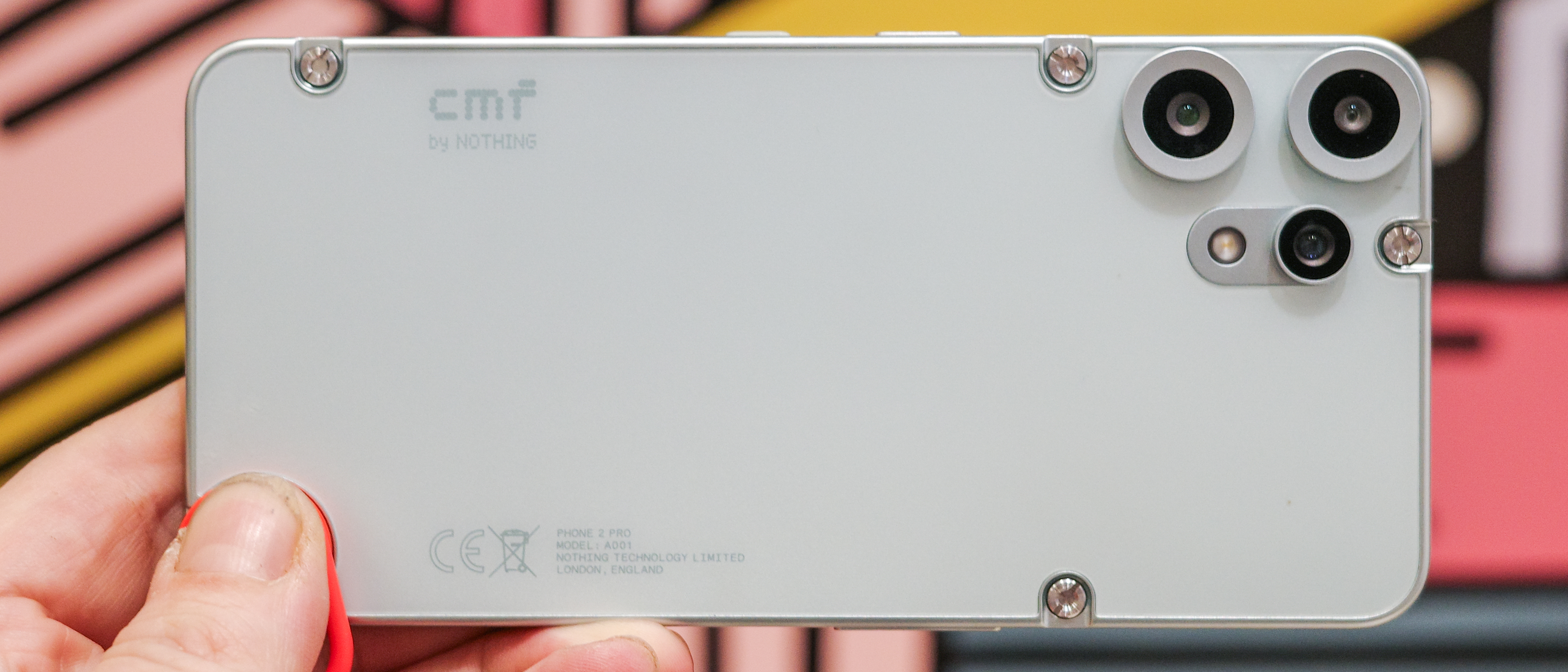 CMF Phone 2 Pro in light green showing back with exposed screws and cameras