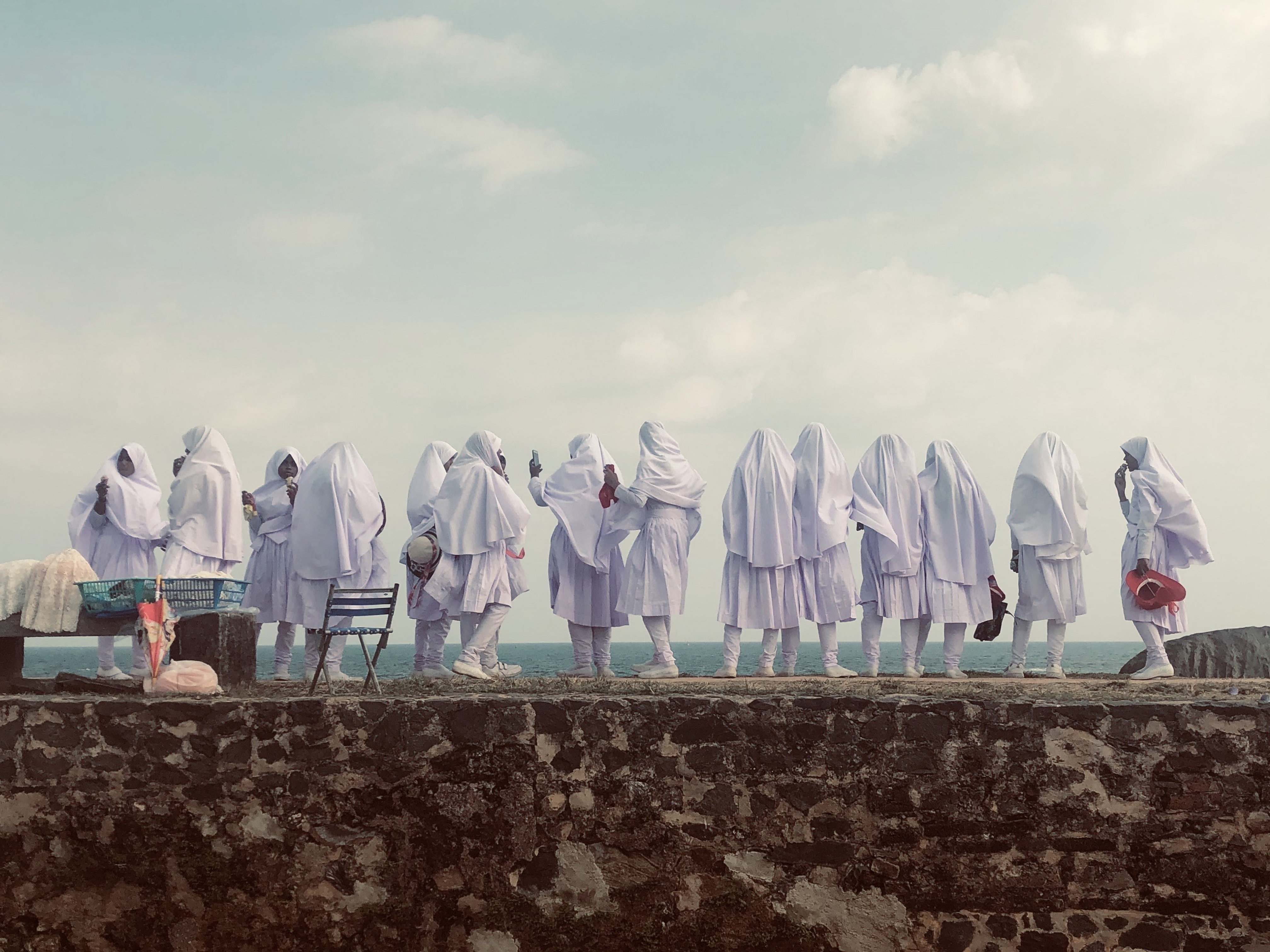 Muslim girls in white robes shot taken for the iPhone Photography Awards 2021