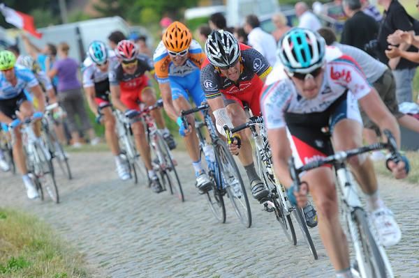 The effort shows on the faces of the Tour's peloton on the pav&eacute;