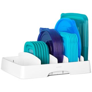 A white tupperware organize with blue lids