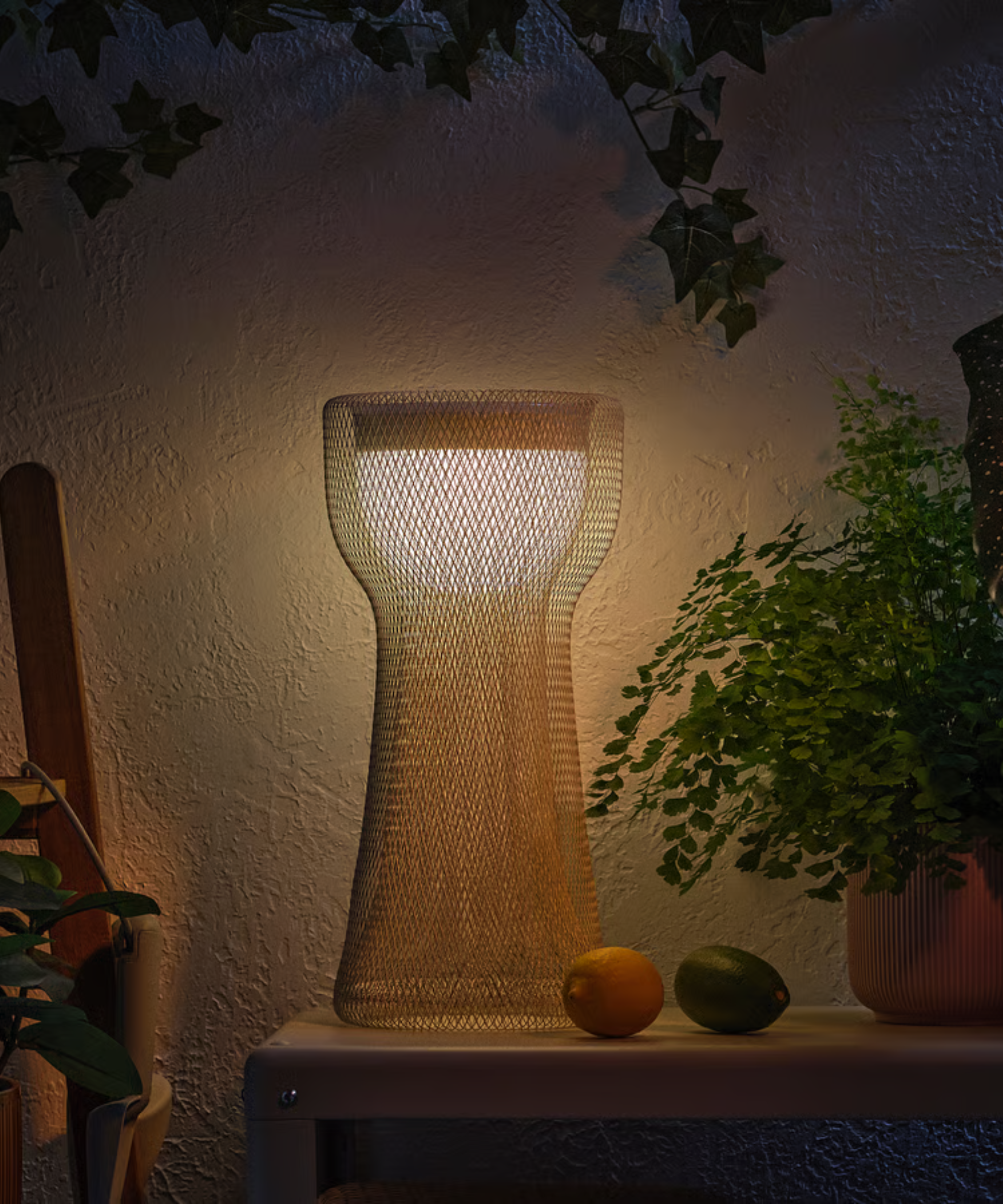 a yellow mesh outdoor lamp from ikea