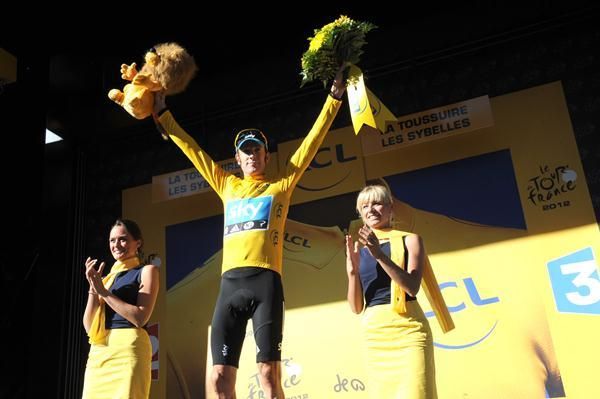 Wiggins shows off the yellow jersey once again at the end of stage 11