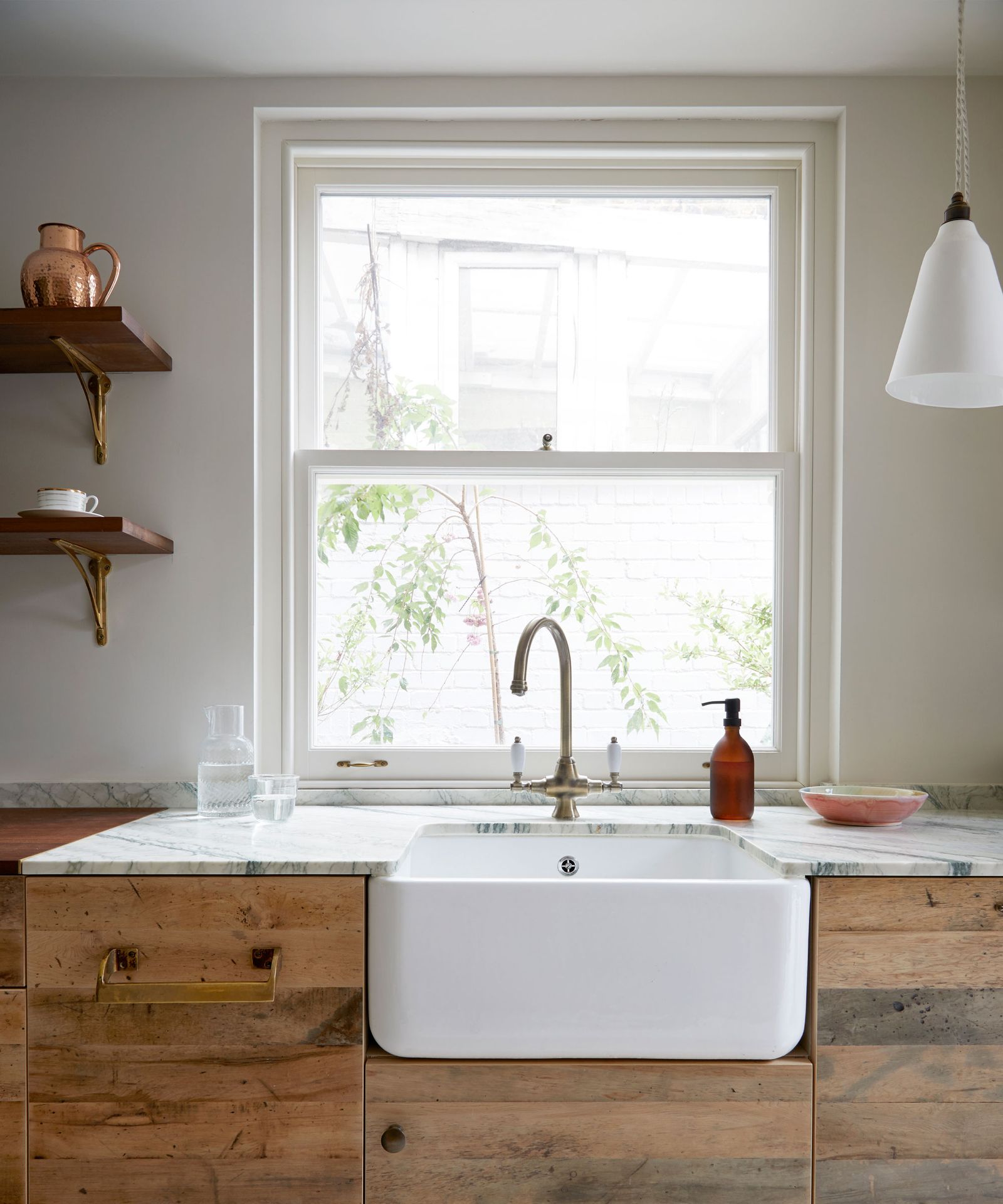 Should a kitchen sink be centered under a window?