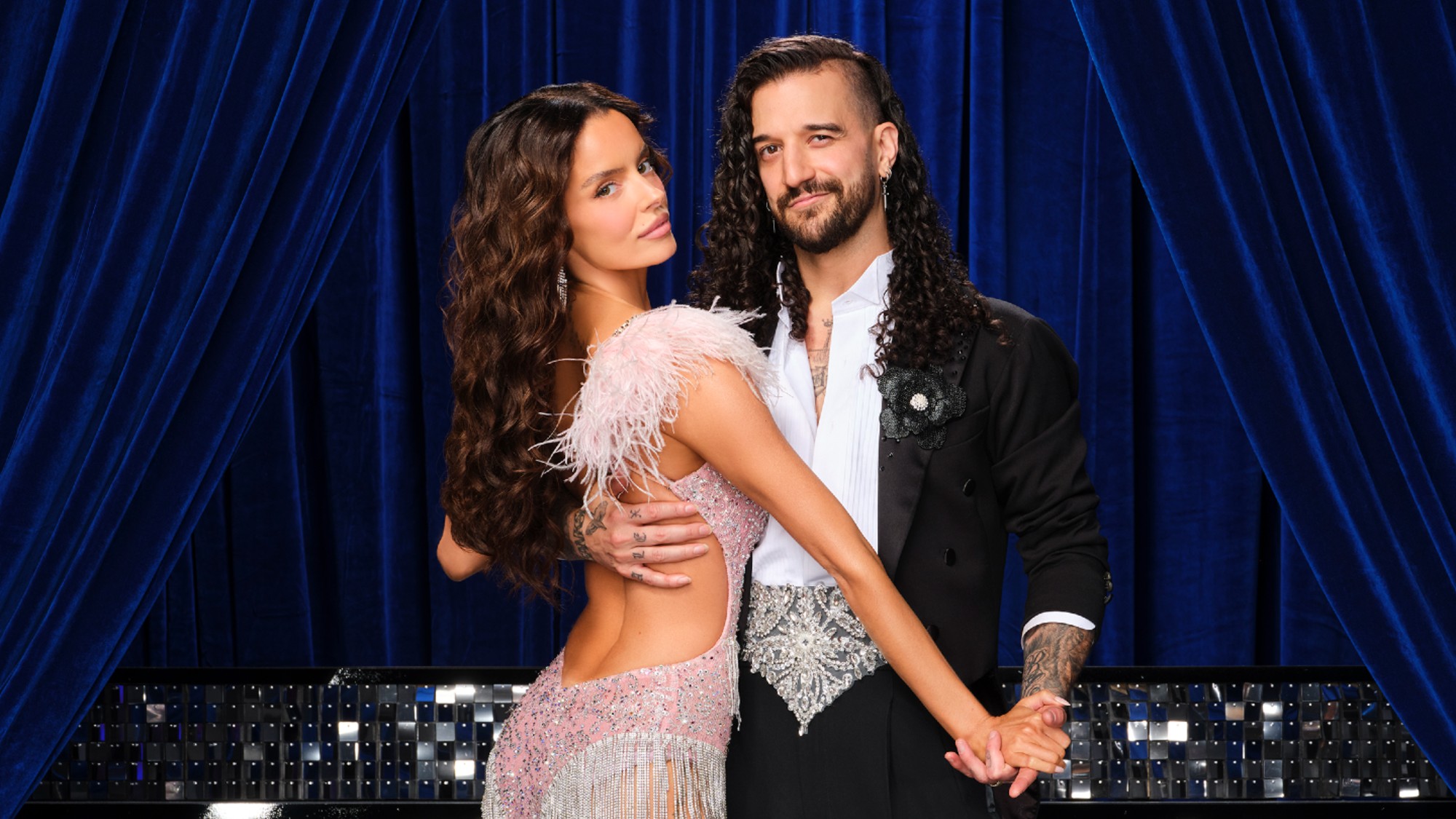 Maura Higgins and Mark Ballas posing or Dancing With the Stars Season 35.