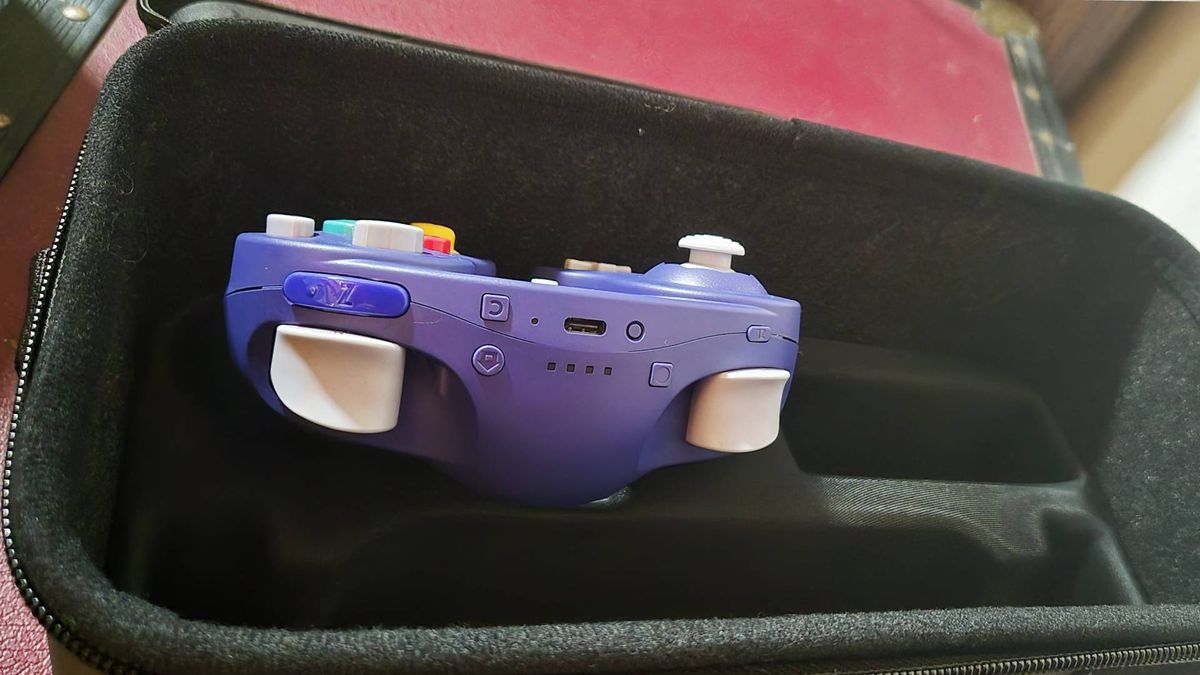 Photo showing the Nintendo Switch Online GameCube controller sitting inside the PlayTrek case.