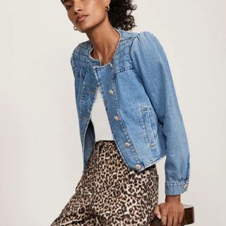 woman wearing denim jacket and leopard print trousers