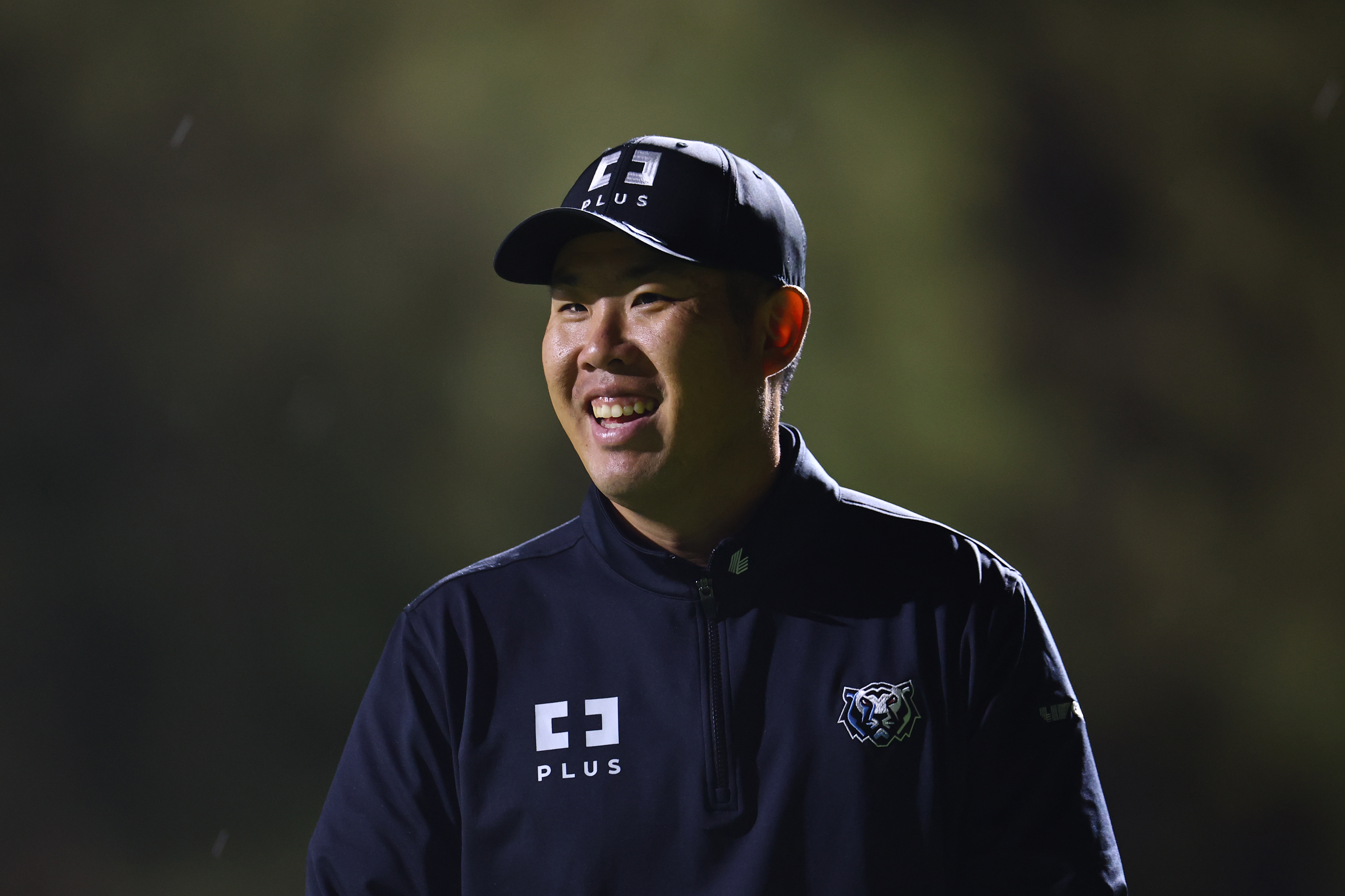 Byeong-Hun An smiles looking into the distance