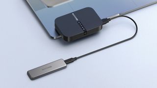 RavPower FileHub AC750 Wireless Travel Router plugged into SSD
