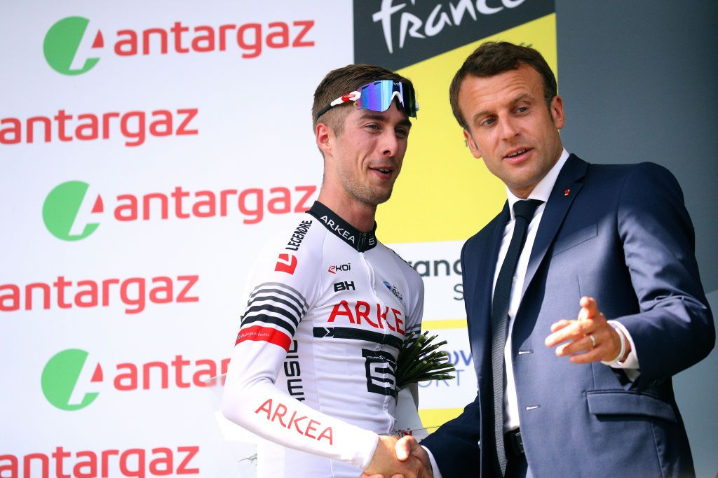 Elie Gesbert is congratulated by French president Emmanuel Macron after stage 14 of the 2019 Tour de France.