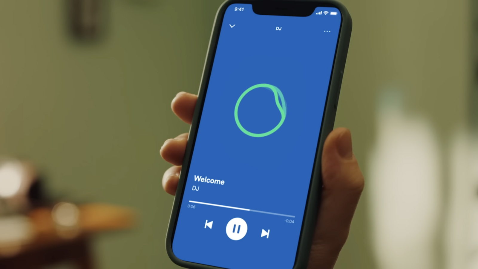 Spotify AI DJ on a phone being held in a hand