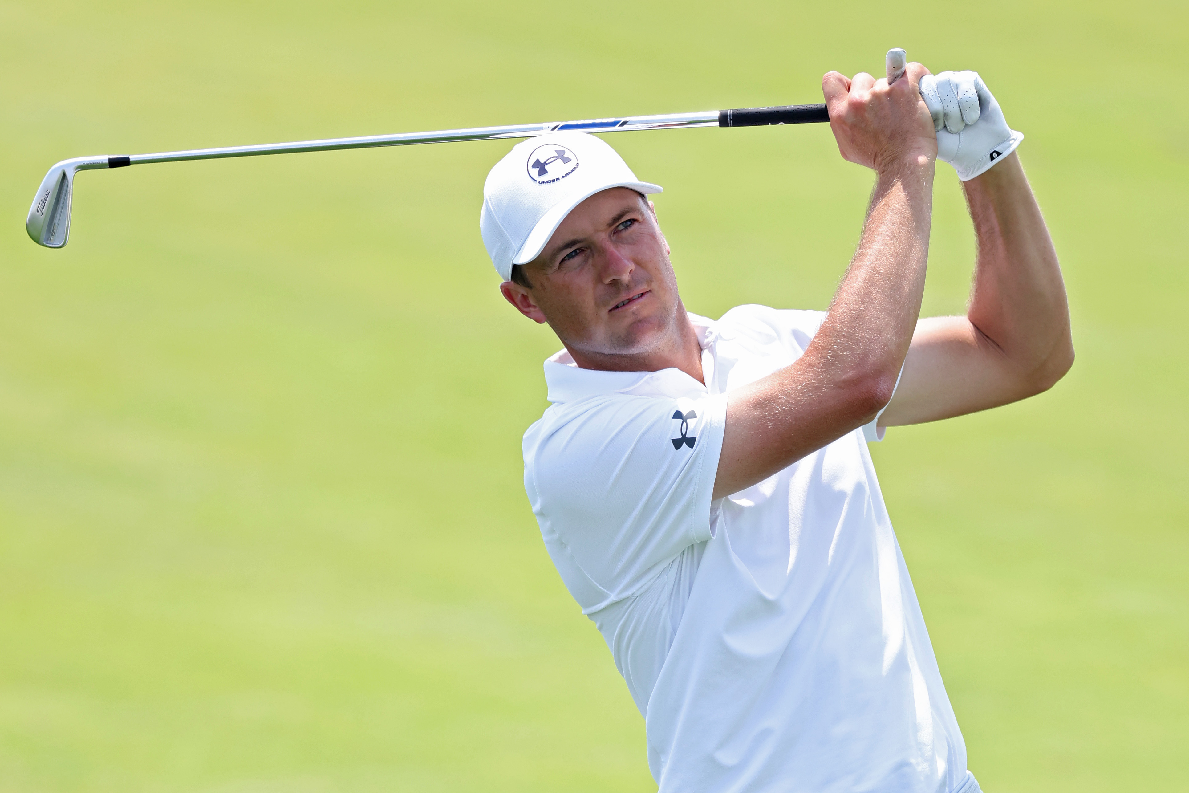 Jordan Spieth hits an iron shot into the green