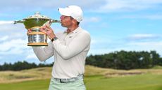 Rory McIlory lifts the trophy after winning the Genesis Scottish Open in 2023. 