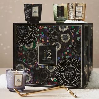 Voluspa 12-Day Advent Calendar against a beige background. 