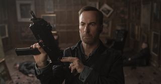 Bob Odenkirk with a machine gun in Nobody