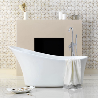 Harding Single Ended Slipper Bath, in front of a mosaic tiled wall with light brown wall feature shelf