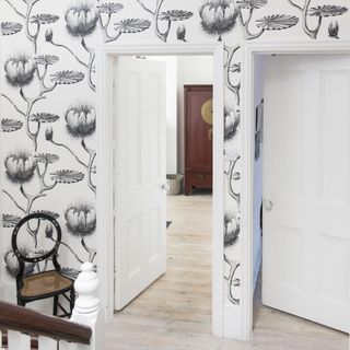 hallway with black and white wallpaper