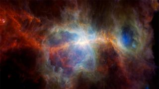 A view o the Orion Nebula with different colors swirling in space