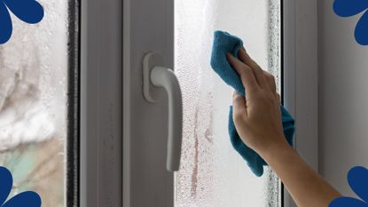woman using microfibre cloth to wipe condensation off window