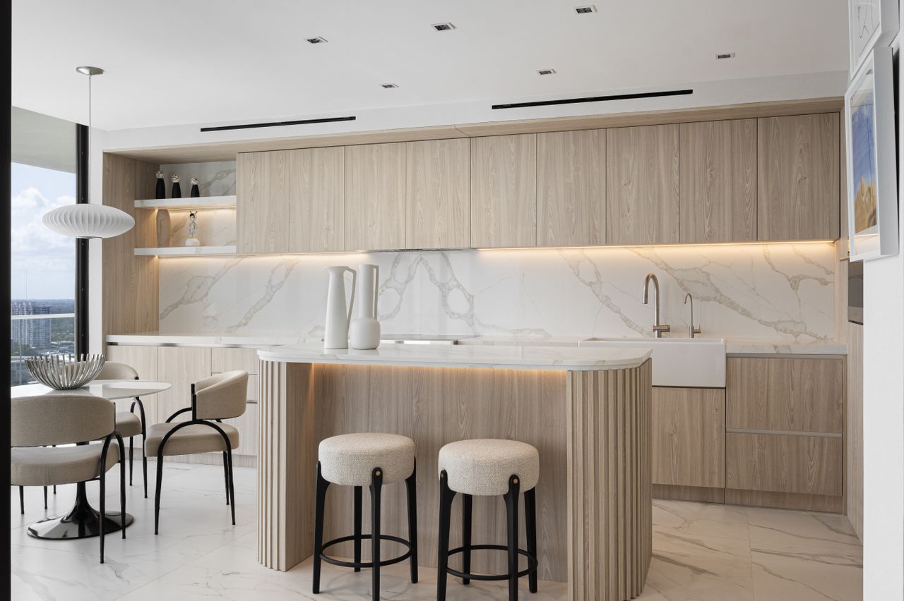 A kitchen with undercabinet lighting