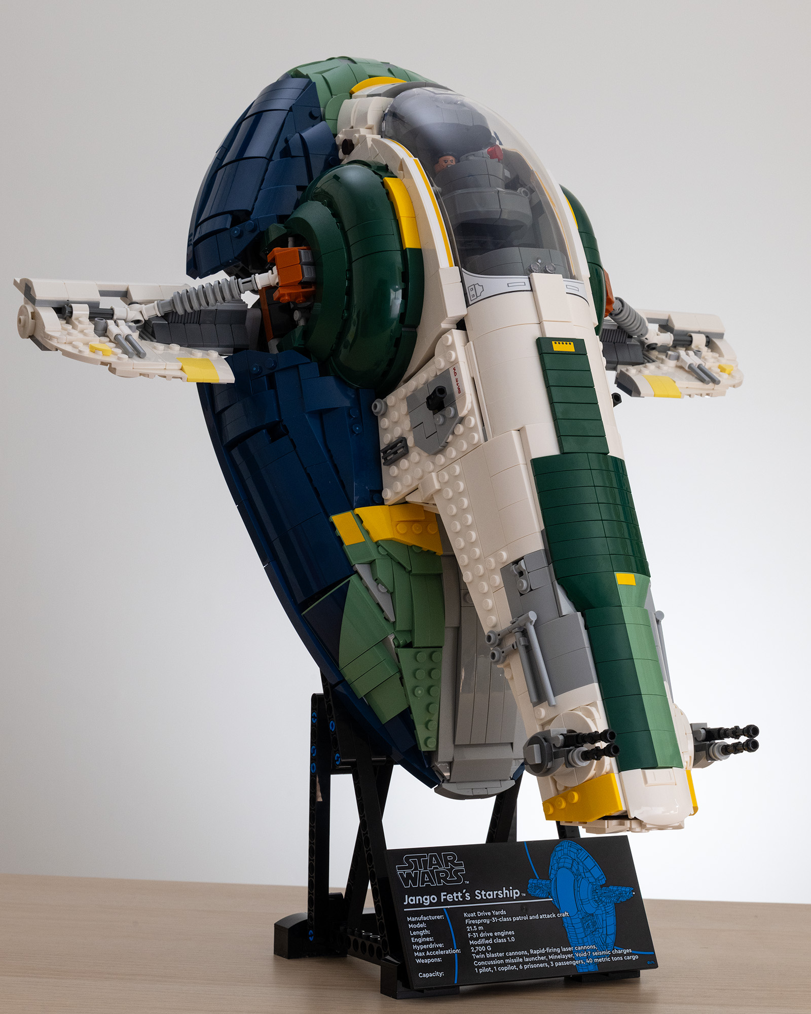 Lego Star Wars UCS Jango Fett&rsquo;s Firespray-Class Starship (75409) on a table with a white background 3/4 image