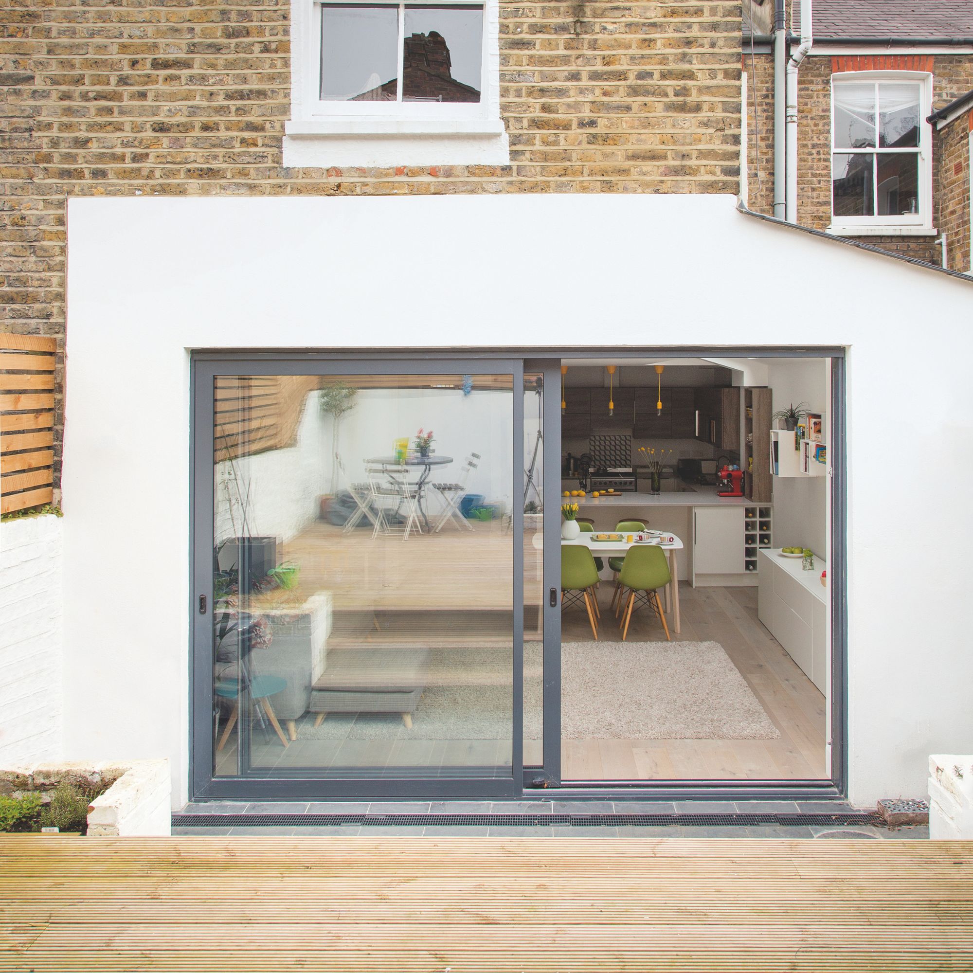 Exterior of house with decking in front of it