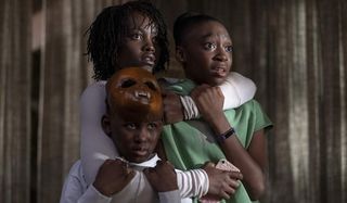 Us Lupita Nyong'o and her film family cower