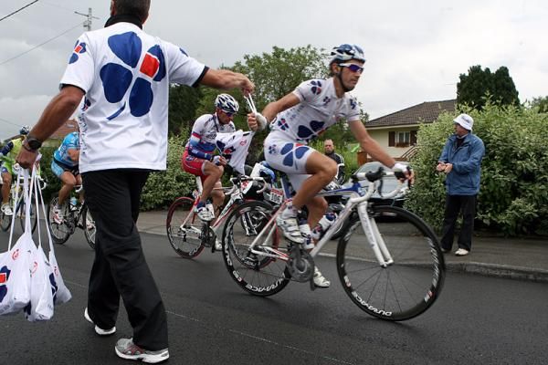 Christophe Le Mevel (Fran&ccedil;aise des Jeux), part of the day-long escape, grabs a musette bag.