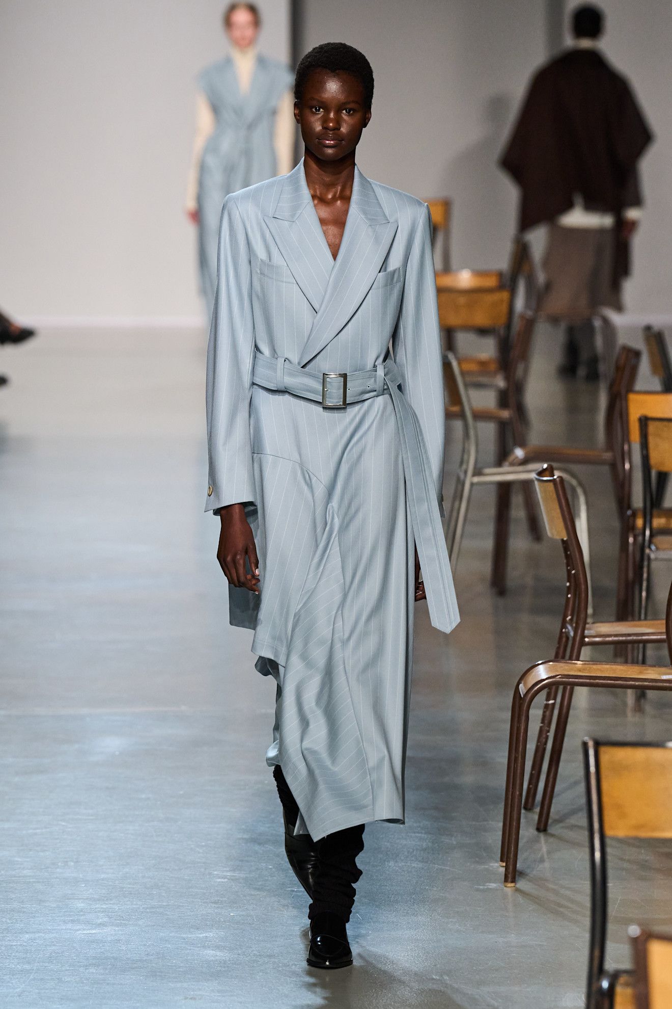 Model wears the baby blue color trend on the runway.