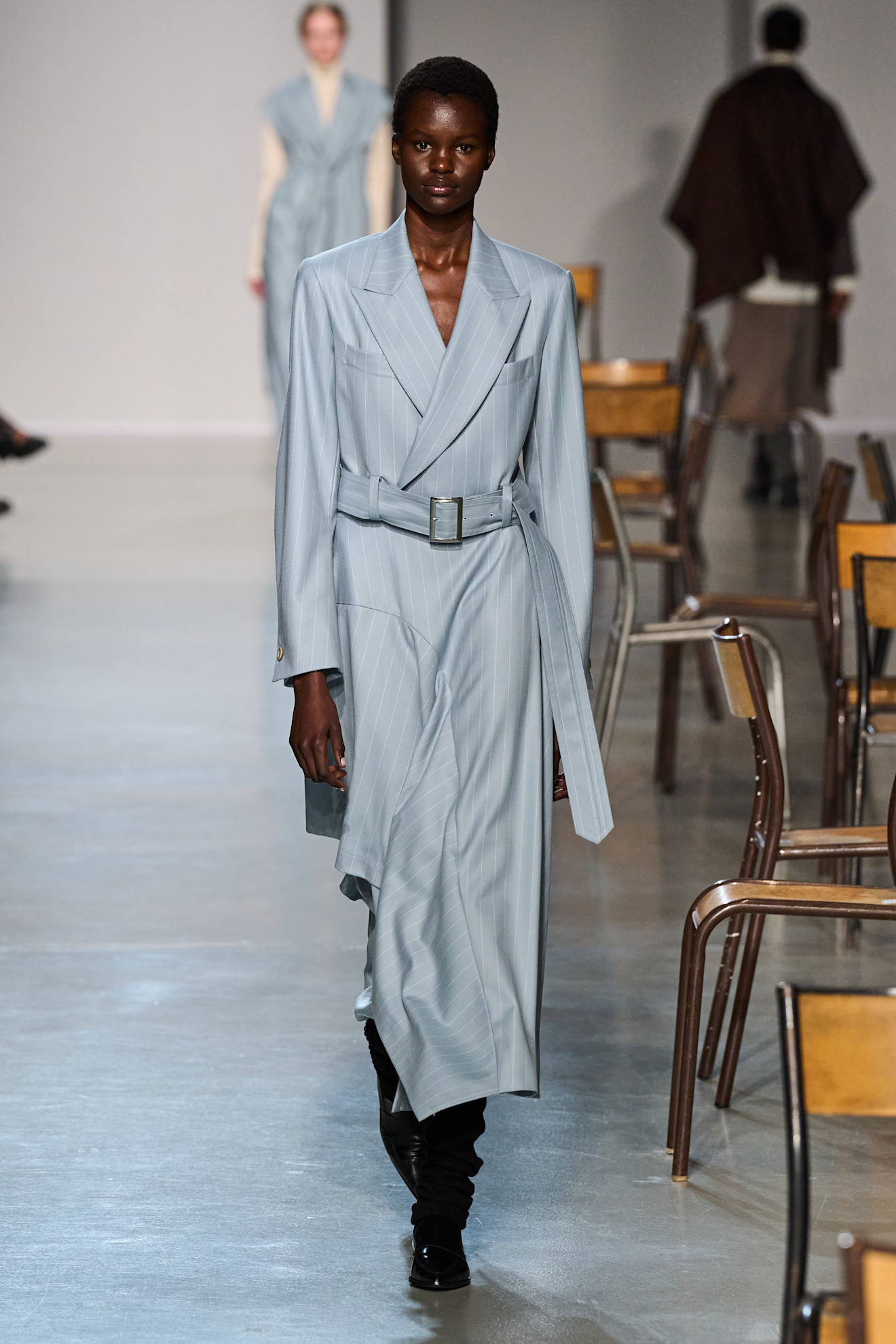 Model wears the baby blue color trend on the runway.