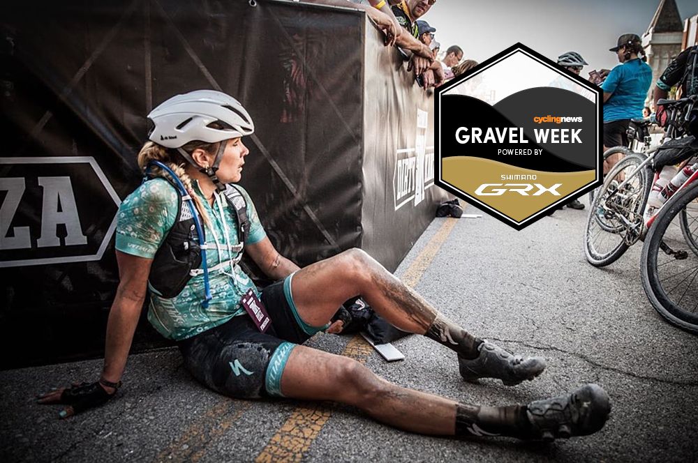 Alison Tetrick sits on the ground after finishing Dirty Kanza