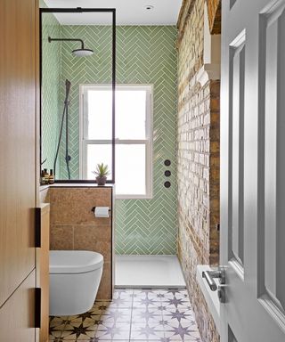 Small bathroom with green metro tiles and shower