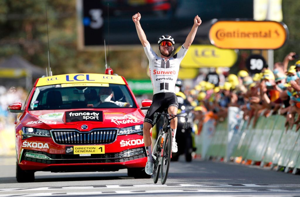 Stage winner Team Sunweb rider Switzerlands Marc Hirschi celebrates as he crosses the finish line at the end of the 12th stage of the 107th edition of the Tour de France cycling race 218 km between Chauvigny and Sarran on September 10 2020 Photo by Sebastien Nogier POOL AFP Photo by SEBASTIEN NOGIERPOOLAFP via Getty Images