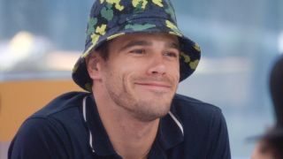 Tucker smiling and wearing a bucket hat in Big Brother Season 26