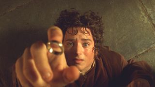 Frodo grabs hold of the One Ring in Lord of the Rings