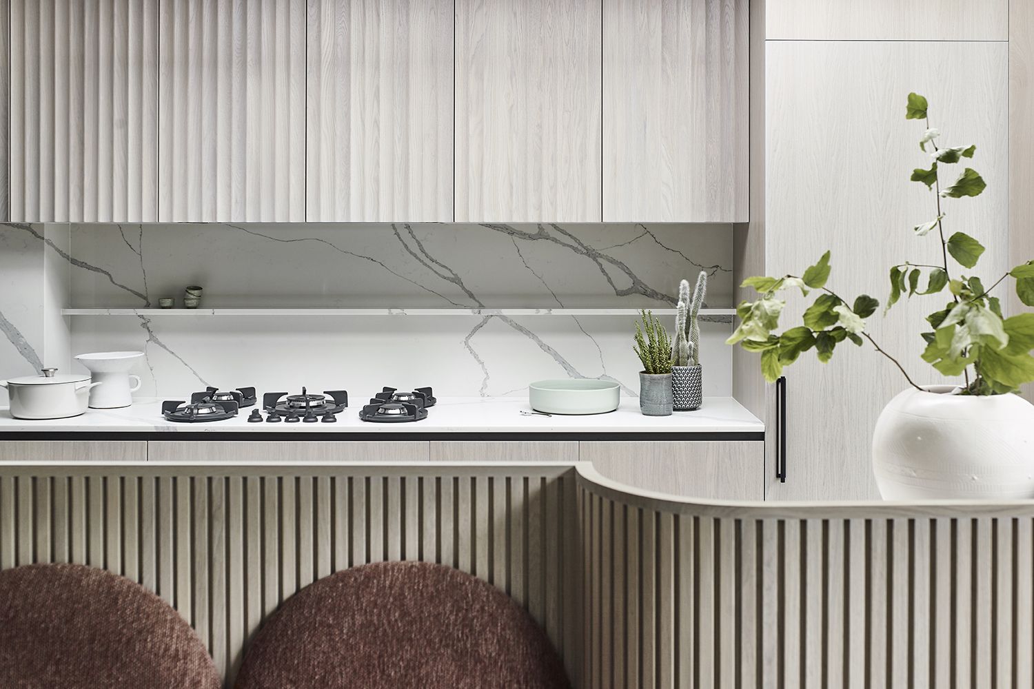 Contemporary beige kitchen cabinets with ribbed detailing