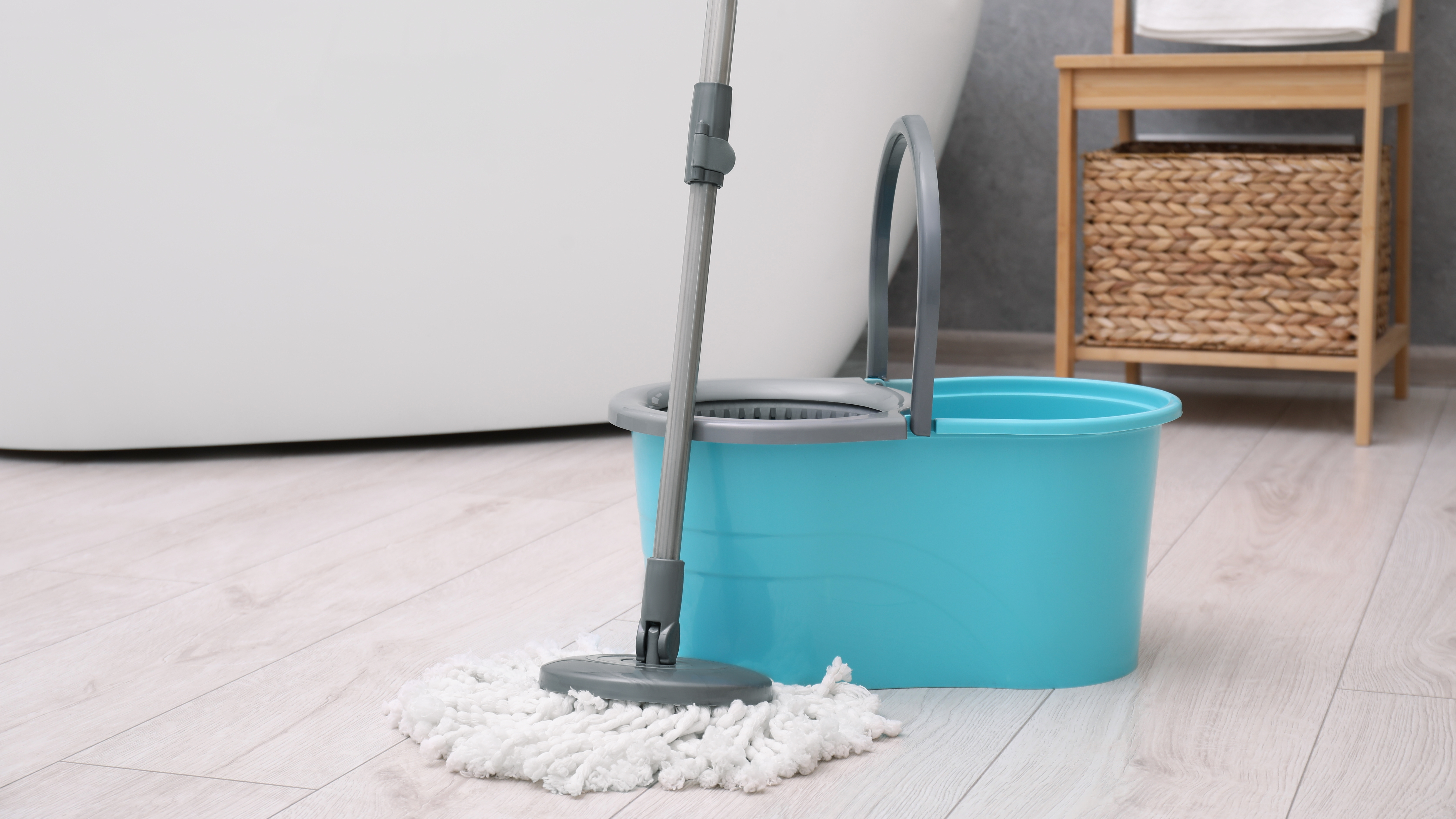 Spin mop and dual bucket on bathroom floor