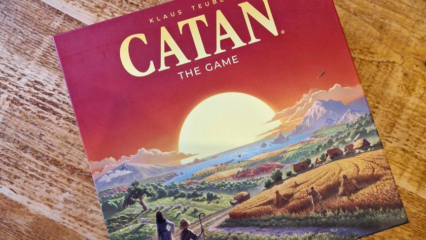 Catan 6th Edition box seen from above on a wooden surface
