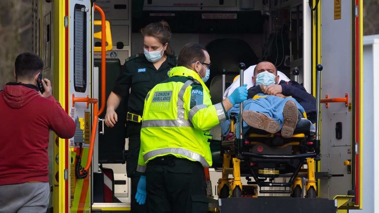 Ambulance staff unload a patient at St Thomas&amp;#039; Hospital, London