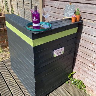 garden bar counter with wine glass and bottle