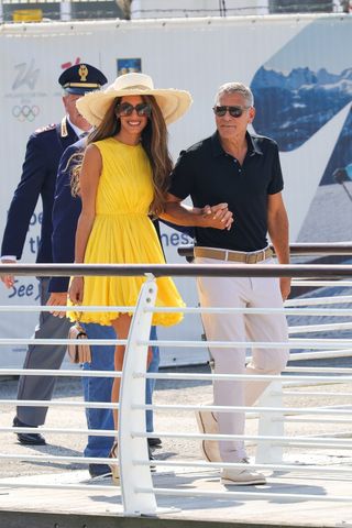 George Clooney and wife Amal are seen arriving at Marco Polo Airport in Venice for the 81st Venice International Film Festival.