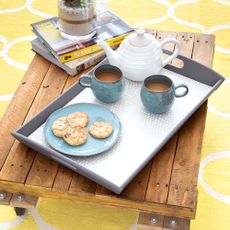 Pallet coffee table with silver tea tray on top