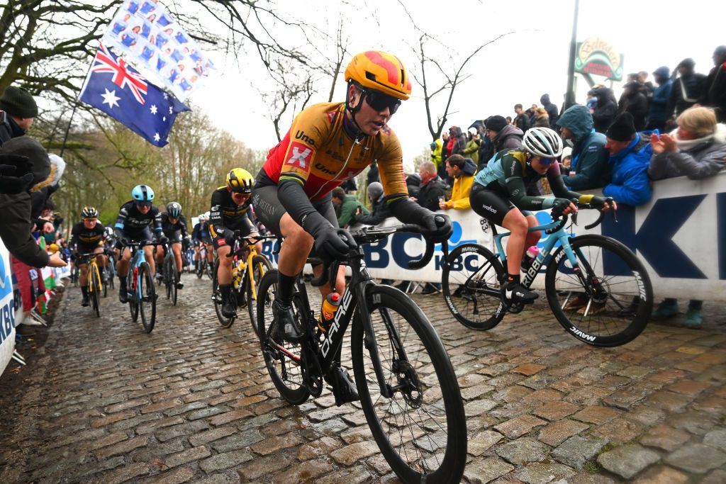 WEVELGEM BELGIUM MARCH 26 Amalie Dideriksen of Denmark and UnoX Pro Cycling Team competes passing through a Kemmelberg cobblestones sector during the 12th GentWevelgem In Flanders Fields 2023 Womens Elite a 1625km one day race from Ypres to Wevelgem UCIWWT on March 26 2023 in Wevelgem Belgium Photo by Luc ClaessenGetty Images