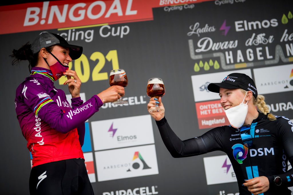Dutch Chantal Blaak of Team SD Worx and Dutch Lorena Wiebes of Team DSM celebrate on the podium of the Dwars Door Het Hageland one day cycling race fourth race of the Bingoal Cycling Cup 180km from Aarschot to Diest Saturday 05 June 2021 BELGA PHOTO JASPER JACOBS Photo by JASPER JACOBSBELGA MAGAFP via Getty Images