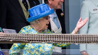 Queen Elizabeth II watches the racing from the royal balcony at the Epsom Derby at Epsom Racecourse on June 1, 2019