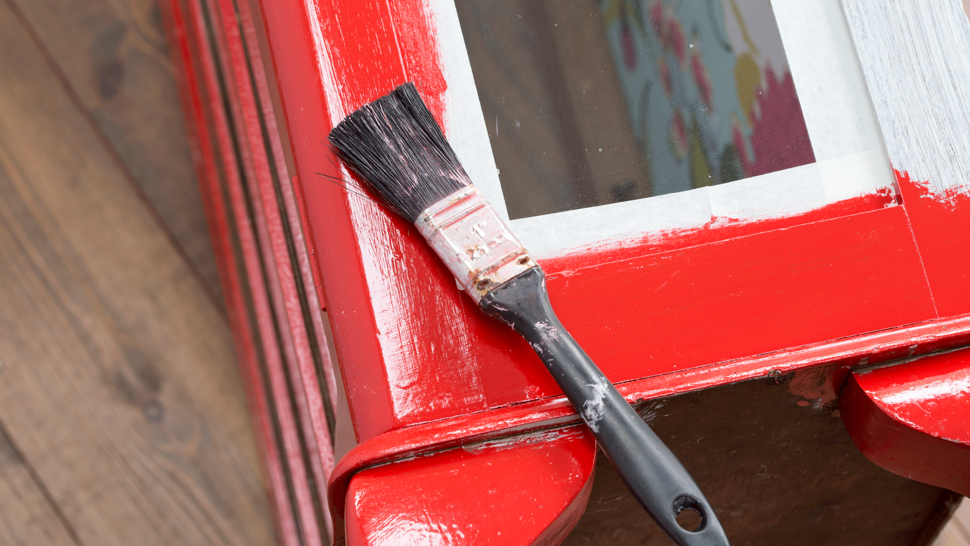 Red cabinet with paint brush