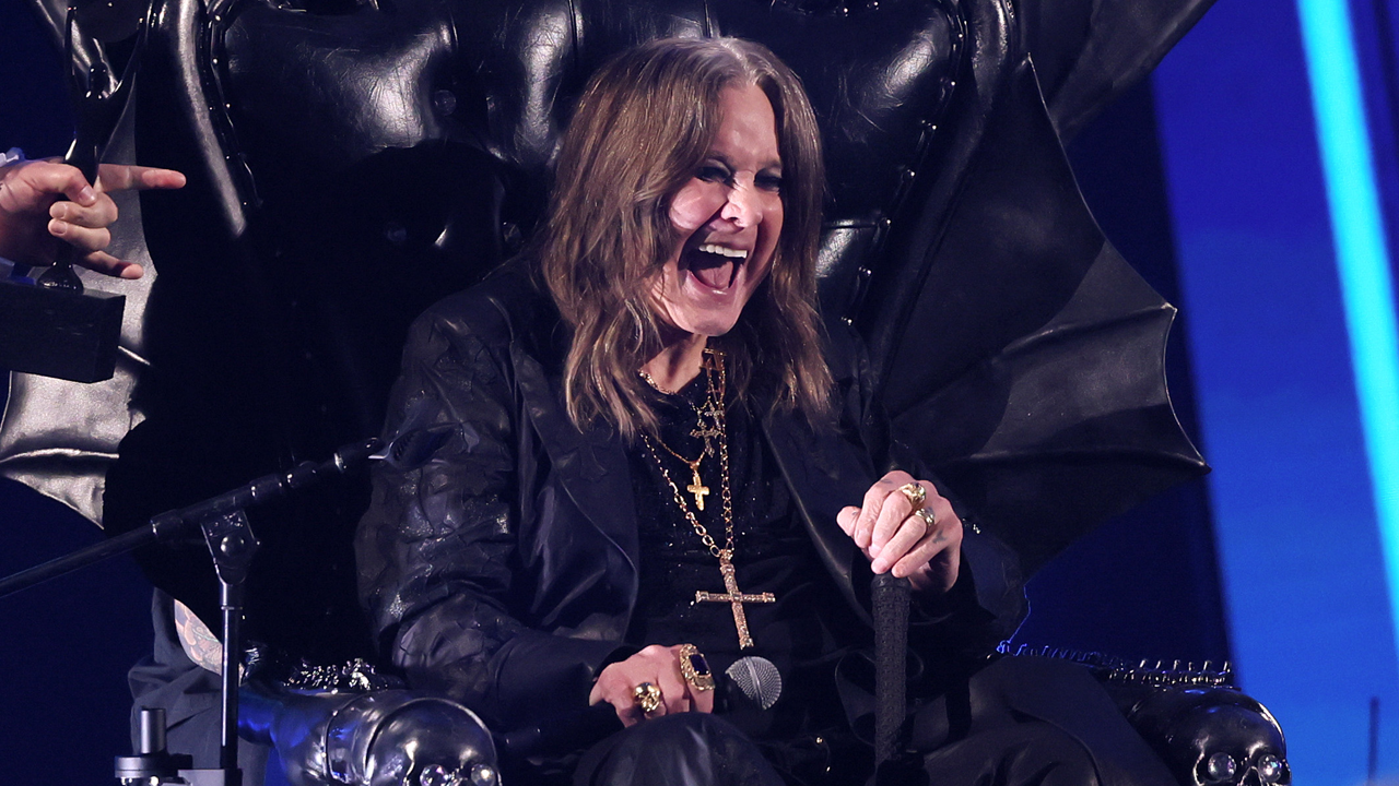 Ozzy Osbourne laughing in a throne